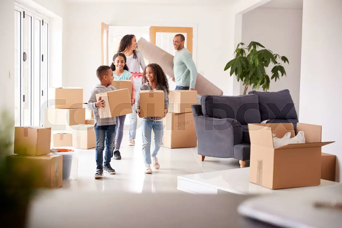 Family moving boxes into new home – AVRillo Conveyancing Reviews